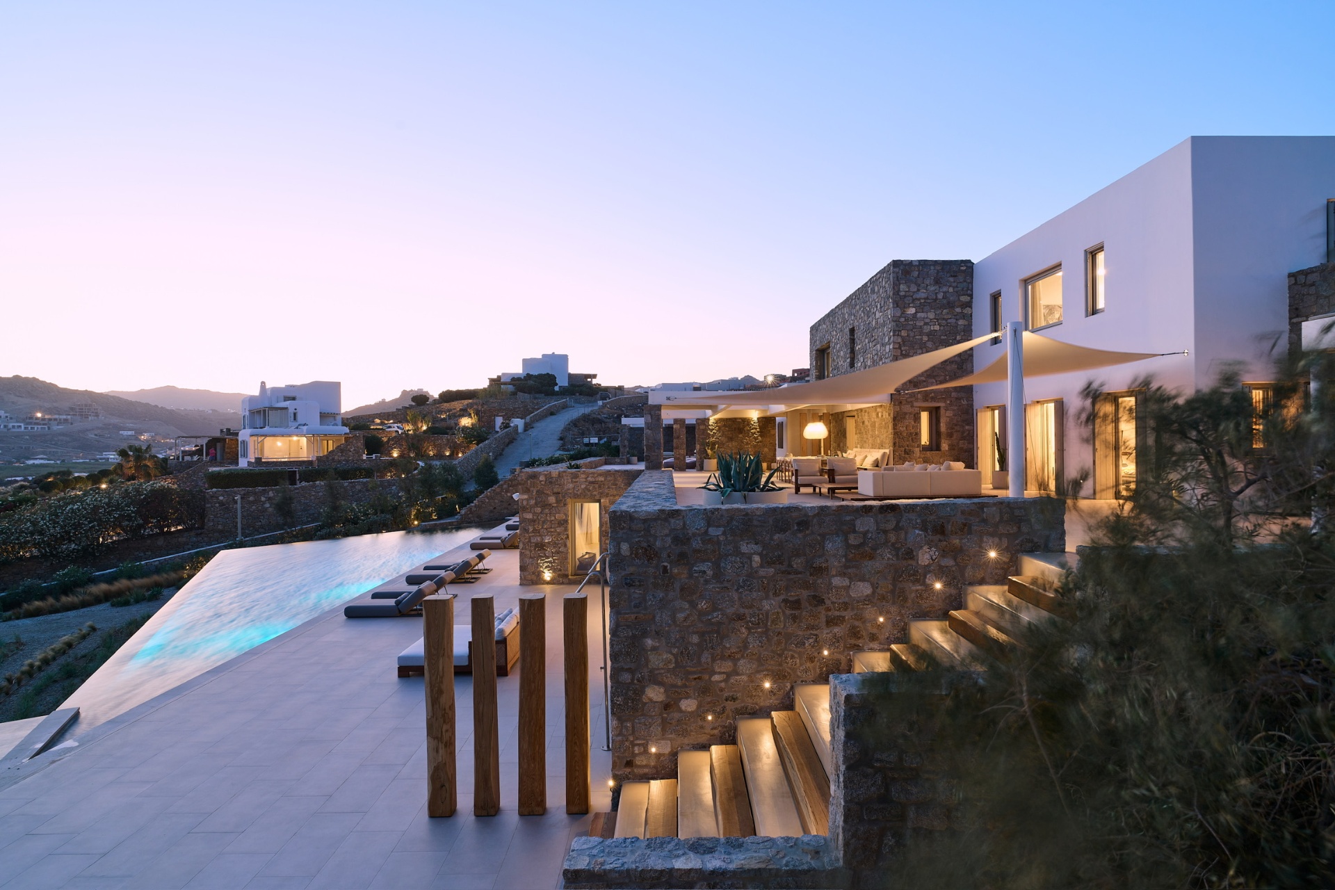 Mykonos villa at dusk with infinity pool