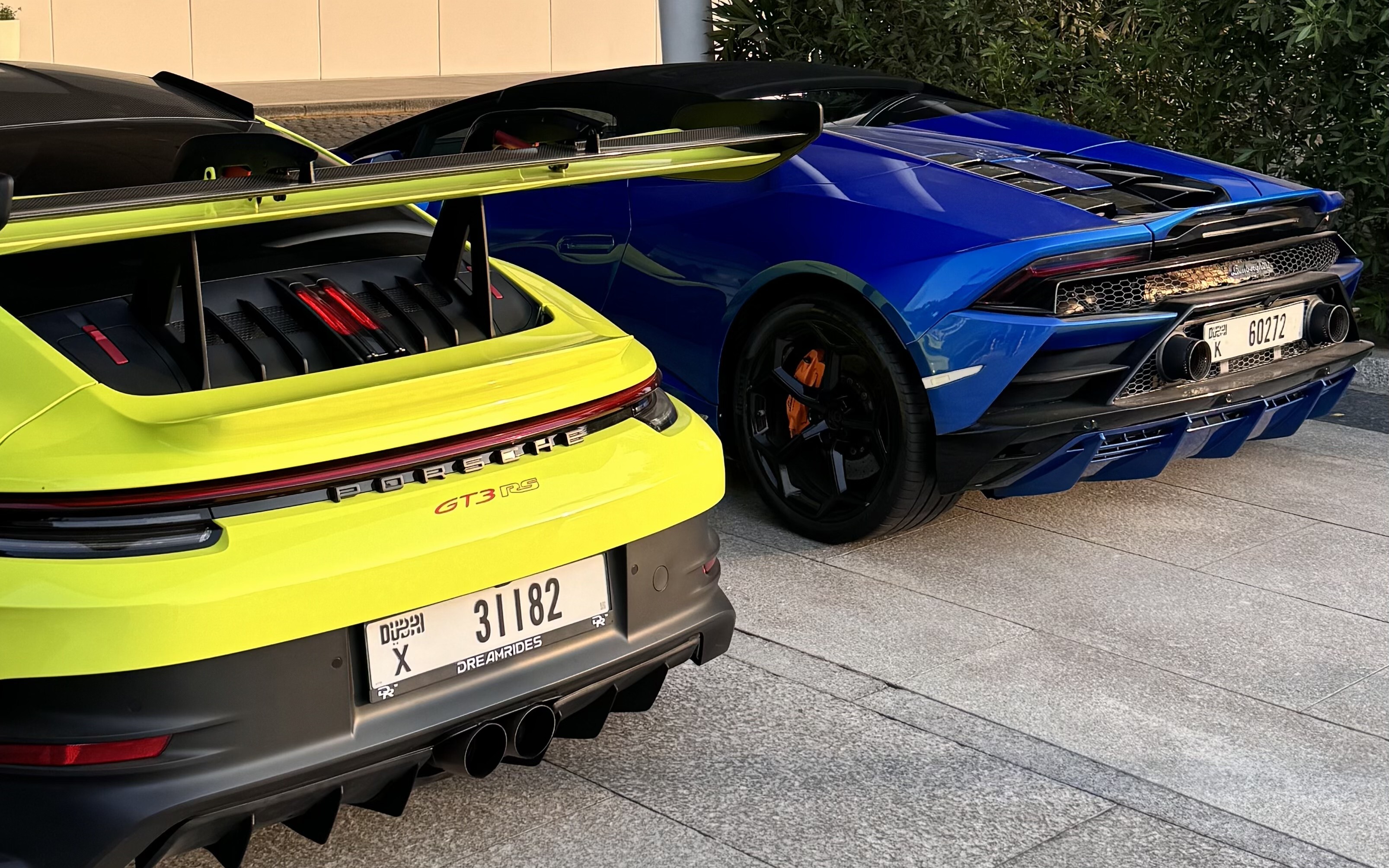 Porsche and Lamborghini parked side by side