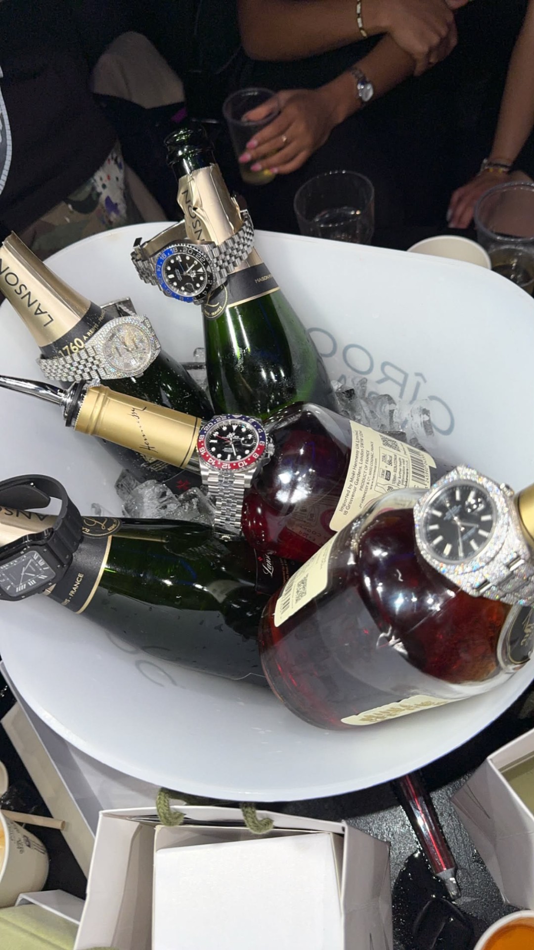 Champagne bucket with luxury watches