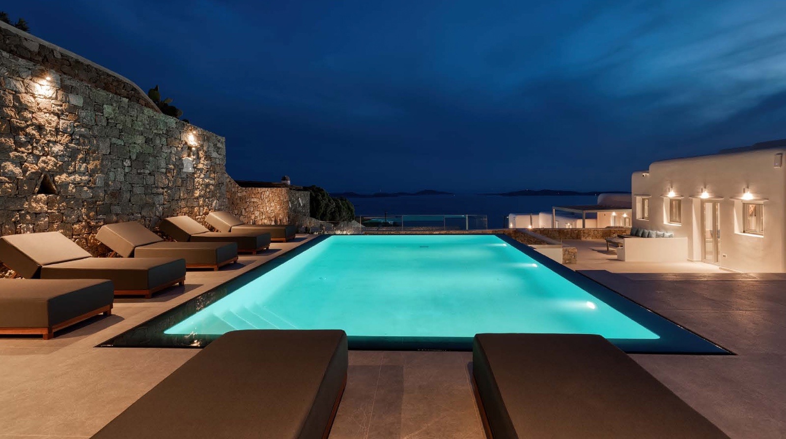 Mykonos pool loungers at dusk