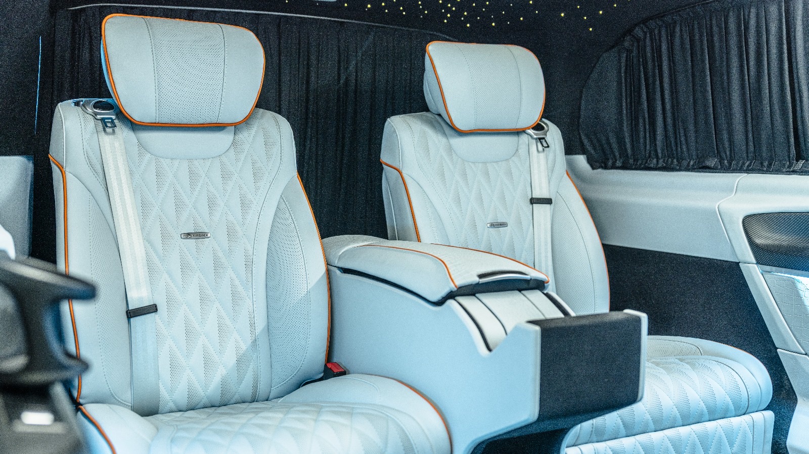 Chauffeur cabin with ice-blue quilted seats and star headliner