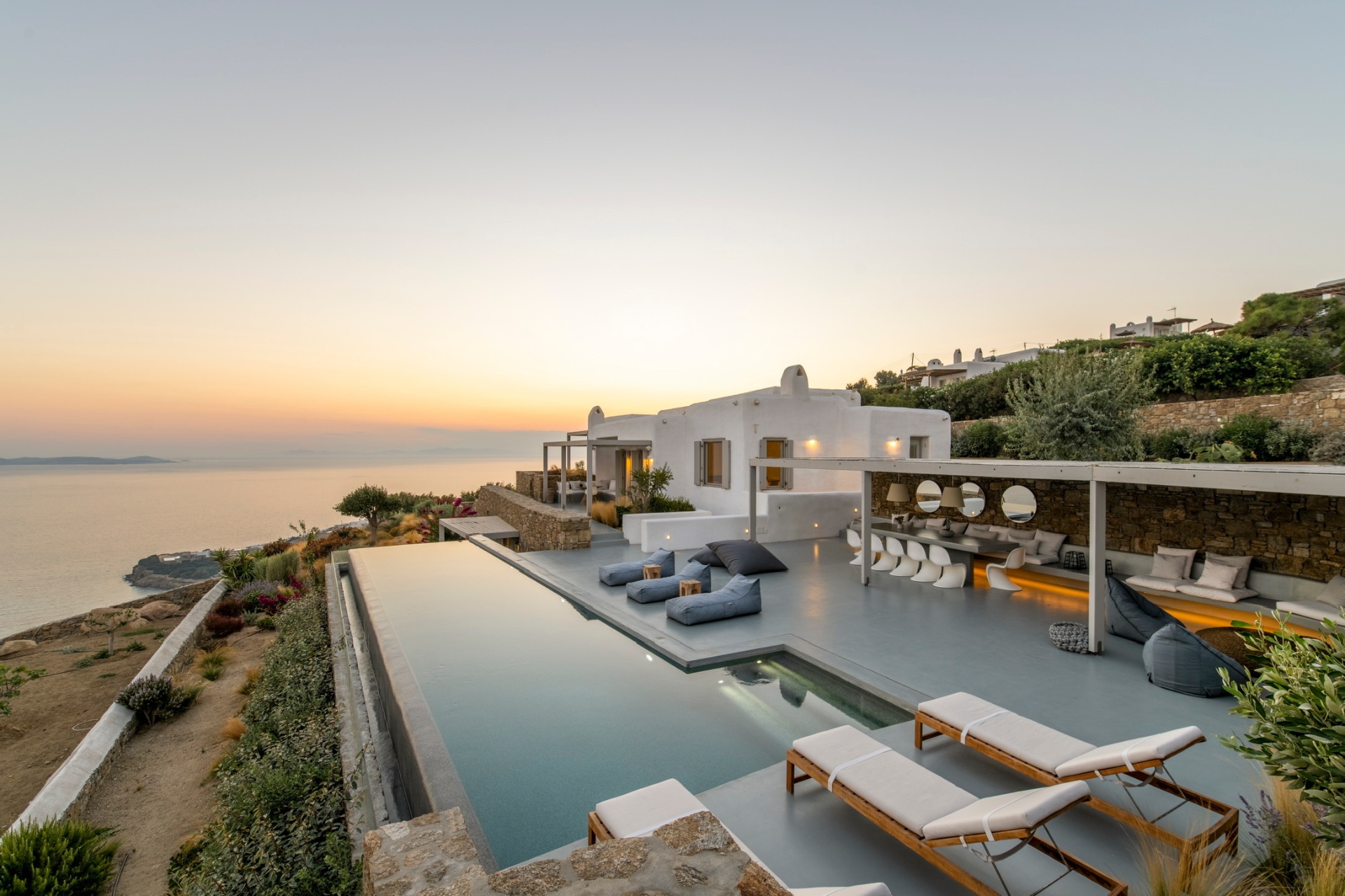 Mykonos villa pool at sunset with lounge
